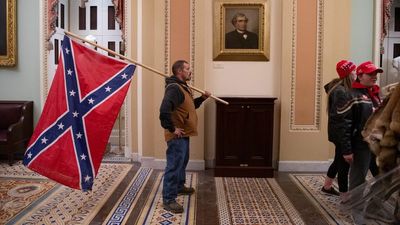 Man who stormed U.S. Capitol with Confederate flag-wielding father gets 2 years in prison