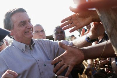 Analysis-Bolsonaro's cash injection gains traction with poor Brazilians ahead of vote