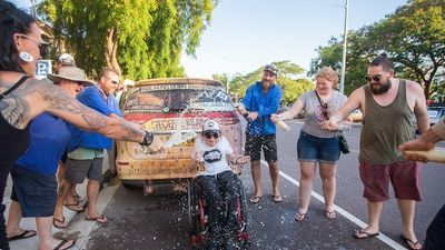 Renovated old car breaks down barriers, lifts spirits, raises money for worthy cause
