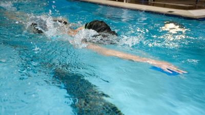 Child hospitalised after suspected chemical exposure at Laurie Lawrence's Gold Coast swim school