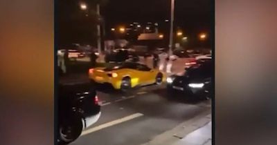 WATCH: Huge crowds as Ferraris and Lamborghinis rev engines and block roads at 'car meet'