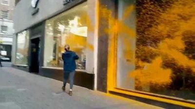 Watch: Just Stop Oil activists spray orange paint over luxury car dealers in London