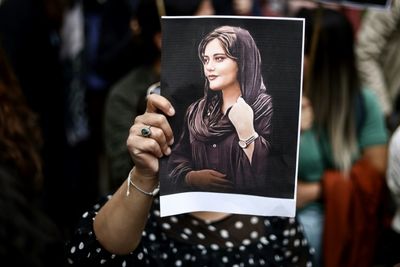 Iran security forces open fire as thousands mourn Mahsa Amini