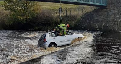 Volkswagen driver rescued after getting trapped in car which got swept away on ford crossing