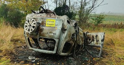 Burnt out car found overturned on Scots golf course