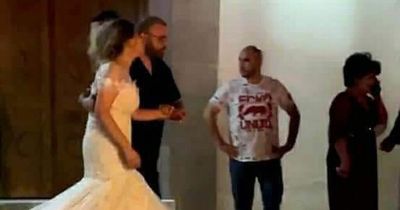 Bride hysterical in blood-soaked dress as husband shot dead leaving church