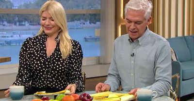 Holly Willoughby recoils and Phillip Schofield shakes head as Alice Beer tells him off for blowing 'short and curlies' at her live on ITV This Morning
