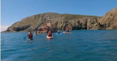 BBC Saving Lives at Sea: 16 paddleboarders rescued from Welsh coast were oblivious to the danger they were in