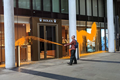 Just Stop Oil activists spray orange paint on Rolex building in central London