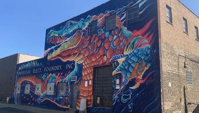 For West Loop foundry, artist painted a mural of a fiery gator