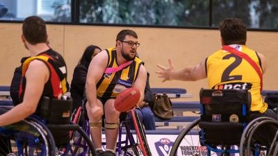 Joe Chivers returns to footy after a skydiving accident left him in a wheelchair