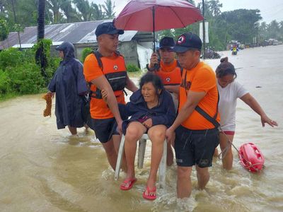 At least 50 are dead and dozens feared missing as storm hits the Philippines