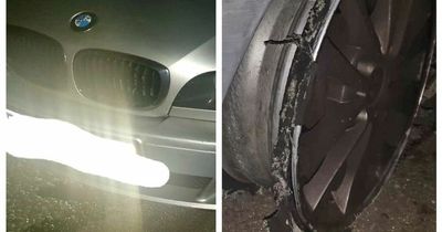 BMW driver arrested on suspicion of drink driving after being 'stopped on M60 doing 30mph with a blown tyre'