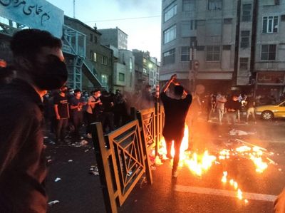 After dark, Iran security forces take aim at protest buildings