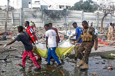 Two explosions rock Somalia's capital, leaving "scores" dead