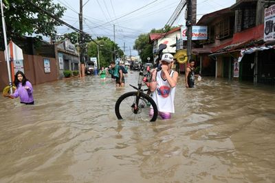 Tropical storm batters Philippines capital before exit