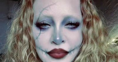 Madonna gets into Halloween spirit as she dons black bustier to transform into sexy zombie