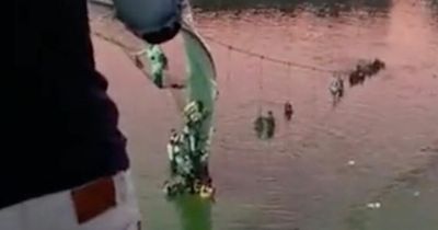 132 people dead and multiple injured after cable bridge COLLAPSES over river in India