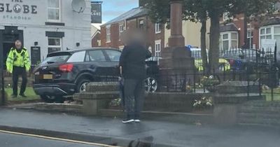 Audi ploughs into war memorial in Greater Manchester high street