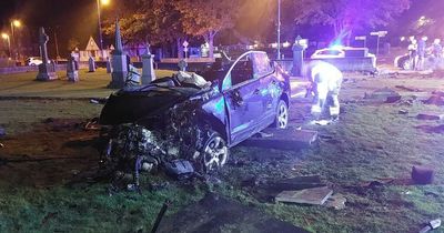 Several graves damaged after car smashes through cemetery wall with woman hospitalised
