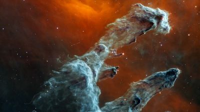 NASA published a 'haunting portrait' of Pillars of Creation for Halloween. Here's why it's a spookier version of its sparkly twin