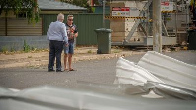 Roof torn off home, powerlines downed as severe storm labelled 'mini tornado' hits Alice Springs