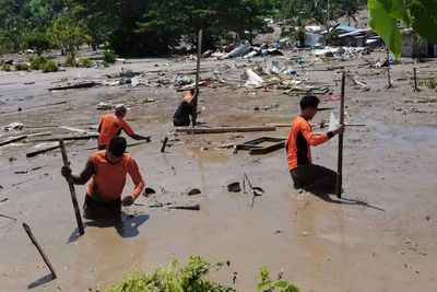 Rescuers search for bodies as Philippines storm death toll hits 98