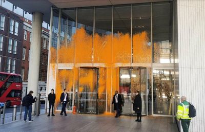 Protesters splatter paint over UK Government buildings and The Sun HQ