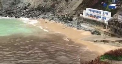 Horrifying moment massive sewage spill leaks into beautiful secluded beach in UK