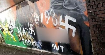Racist graffiti scrawled over community mural hours after it was finished