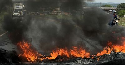 Protestors burn tyres and set up huge roadblocks after Bolsonaro loses Brazil election