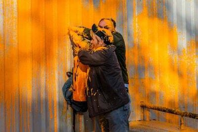 Watch moment man tackles Just Stop Oil protester covering them in paint outside MI5 building