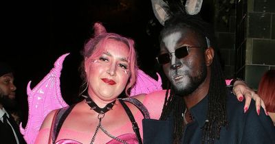 Honey Ross cuddles up to boyfriend as punky pink devil at dad's famous Halloween bash