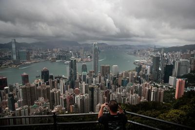 Cyclone, absences threaten to dull Hong Kong finance meeting