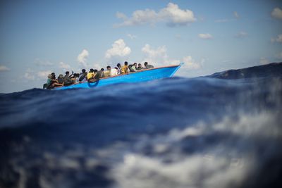 Dozens missing after refugee boat sinks off Greek islands