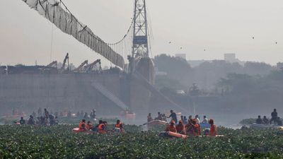 Indian PM to visit collapsed bridge in Gujarat as rescuers continue search for bodies