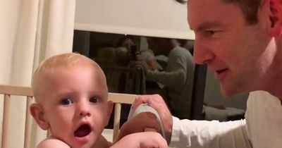 Baby baffled by dad's new look revealed during game of peek a boo