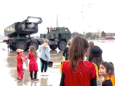 US military uses advanced weaponry to shoot out Halloween candy for children: ‘Super cute or super twisted’