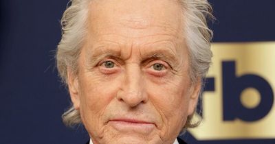 Michael Douglas looks unrecognisable as he dons brand new look with auburn hair