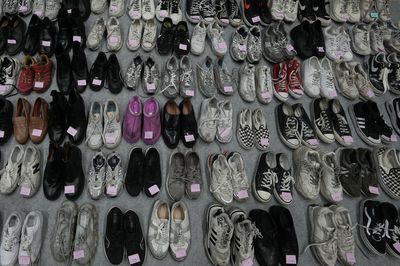 After the tragic crush, hundreds of lost shoes await their owners at a Seoul gym