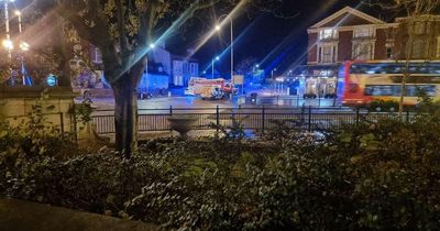 Roads closed as Porsche and Ford crash on busy roundabout