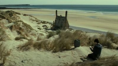 'Dobby's grave' won't be removed from a protected Welsh beach, but Harry Potter fans have been asked to stop leaving socks there