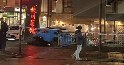 BMW smashes into popular Manchester restaurant with three rescued from wreckage