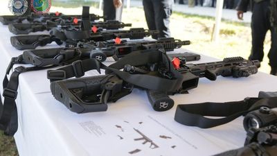 Australian Federal Police gives Solomon Islands police semi-automatic rifles, vehicles