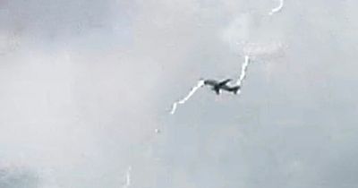 Incredible moment lightning bolt strikes plane in mid-air during stormy weather