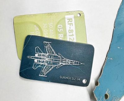 Ukrainians sell luggage tags made from downed Russian planes to fund defence