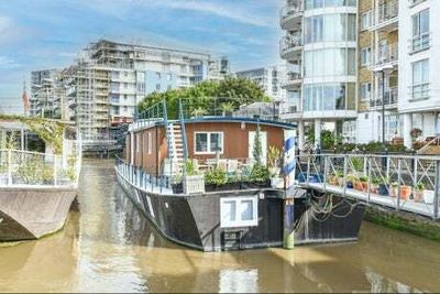 Dinners with royalty and hog roasts on Bonfire Night: £1.8m house boat for sale with Putney mooring