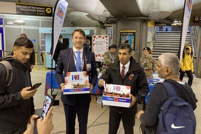 Rishi Sunak surprises commuters as he sells poppies in Westminster Tube station