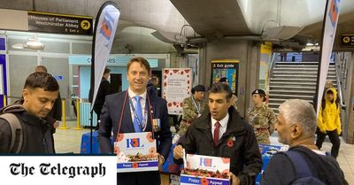 Rishi Sunak surprises commuters by selling poppies at central London Tube station