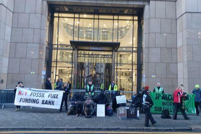 Climate activists target fossil fuel backing bank in Glasgow on eve of COP27